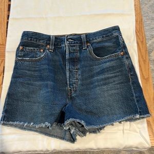 High waisted 5 buttons fringed on bottom.